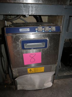 an image of a machine that has a pink sticker on it