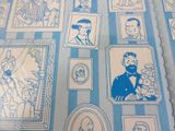 a blue and white wallpaper with pictures of people on it