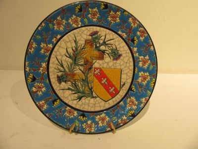 a decorative plate with a coat of arms and a shield on it