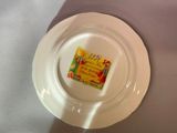 a white plate with a label on it on a table