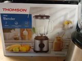 a blender that is sitting on a table next to a box
