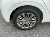 a white car that is parked in the parking lot
