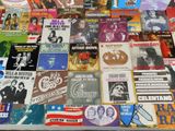 many different types of music cds on the table