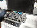 a computer on a table with a keyboard and a monitor
