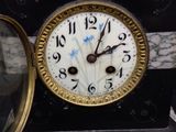 a clock that is sitting on top of a table