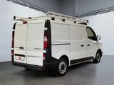 the back of a white van with a ladder on top of it