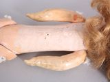 a close up of a doll on a table