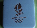 a blue box with the olympic logo on it