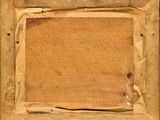 an old picture of a piece of wood with a piece of paper on it