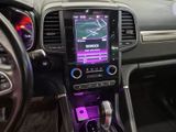 the interior of a car with a purple light on the dashboard