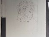 a drawing of a man with a beard on a piece of paper