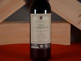 a bottle of wine that is sitting on a table