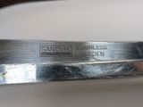 a knife that is laying on a table