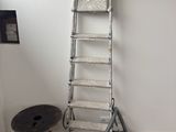 a ladder that is leaning against a wall in a room