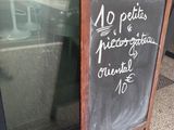 a chalk board that is outside of a restaurant