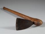 an old axe and an old axe on a white surface