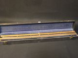 a case that has a pencil in it on a black background