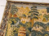 a tapestry with a picture of an owl and a bird on it