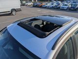 a car that is parked in a parking lot with other cars