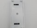 a close up of a white plastic device cover on a white surface