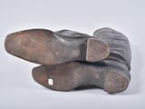 pair of brown leather boots on a white background
