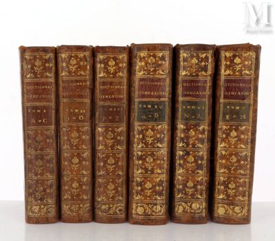 six vieux livres sont alignés sur une surface blanche