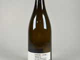 a bottle of wine that is sitting on a table
