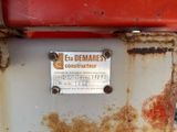 a rusted sign on the side of a rusted machine