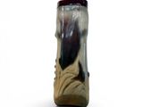 a vase with a black and white design on it