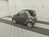 an image of a small car parked in a garage