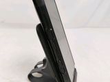 a cell phone that is sitting on a stand