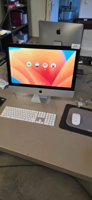 a desk with a computer, keyboard, mouse and mouse on it