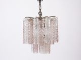 a close up of a glass chandelier hanging from a ceiling