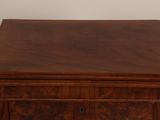 a wooden chest of drawers with a drawer on top of it