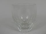 a close up of a glass on a white surface