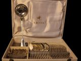 a wooden box with a set of silverware in it