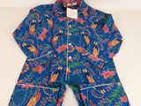 a close up of a child ' s blue pajamas and pants