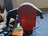 a red machine that is sitting on top of a table