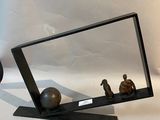 a picture of a mirror and a vase on a table