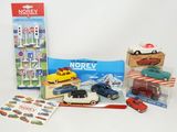 a lot of toy cars that are sitting on a table