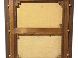an old wooden frame with a picture of a man and a woman