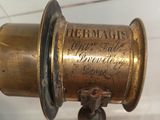 an old brass telescope on display in a glass case