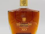 a close up of a bottle of liquor on a white surface
