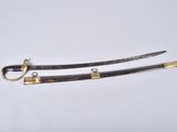 two swords with brass fittings and wooden handles