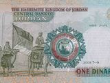 a picture of a bank note with a picture of a man riding on a camel