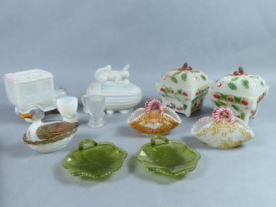 many different types of dishes and dishes on the table