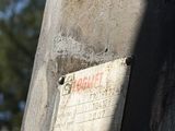 a sign on the back of an old truck