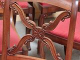 many chairs that are lined up in a room