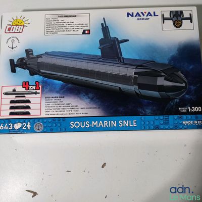 a box with a model of a submarine sitting on a table