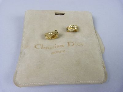 pair of christian dior earrings in yellow gold